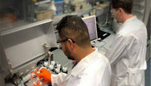 Dr. Jose Angél Danglad-Flores and Dr. Eric Sletten working at the Glyconeer 3.1, an automated glycan assembly device developed by Prof. Dr. Seeberger’s research group. © MPICI