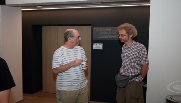 Colleagues connect and converse during the pre-lecture reception