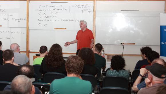 Prof. Shmuel Weinberger speaking on "Geometry of Nonlinear Function Spaces" at the School of Mathematical Sciences colloquium.